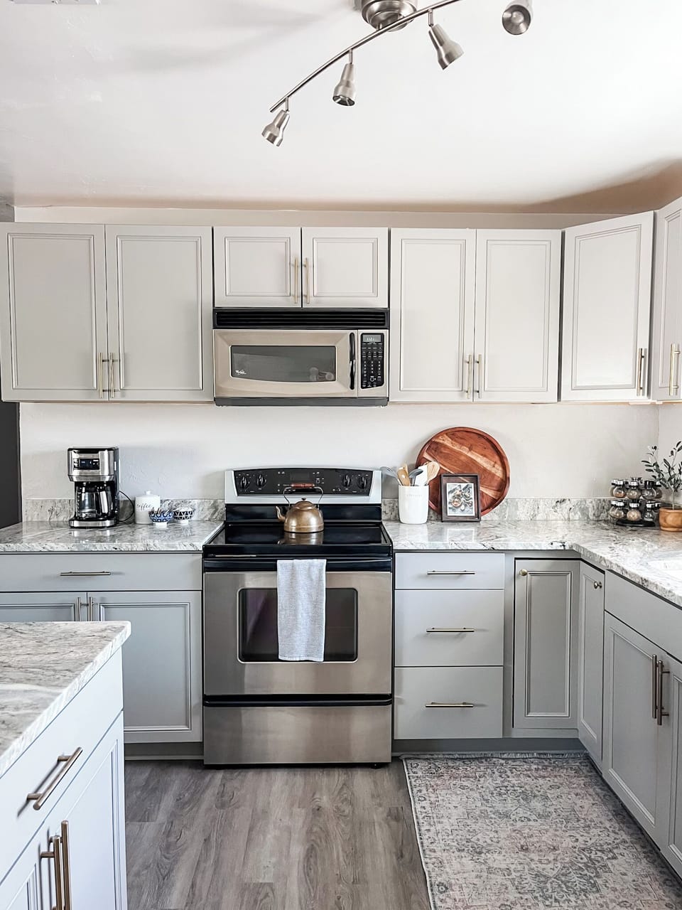 Electric stove, microwave, and traditional coffee maker are some of the kitchen amenities offered.