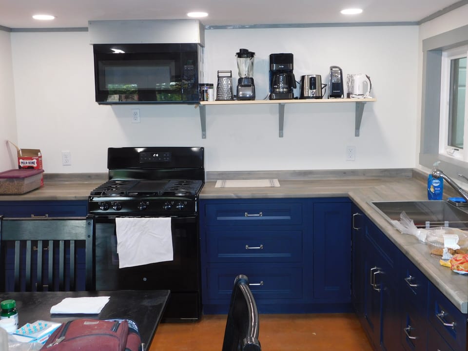 Kitchen with Added shelf for small appliances. Fully equipped. 