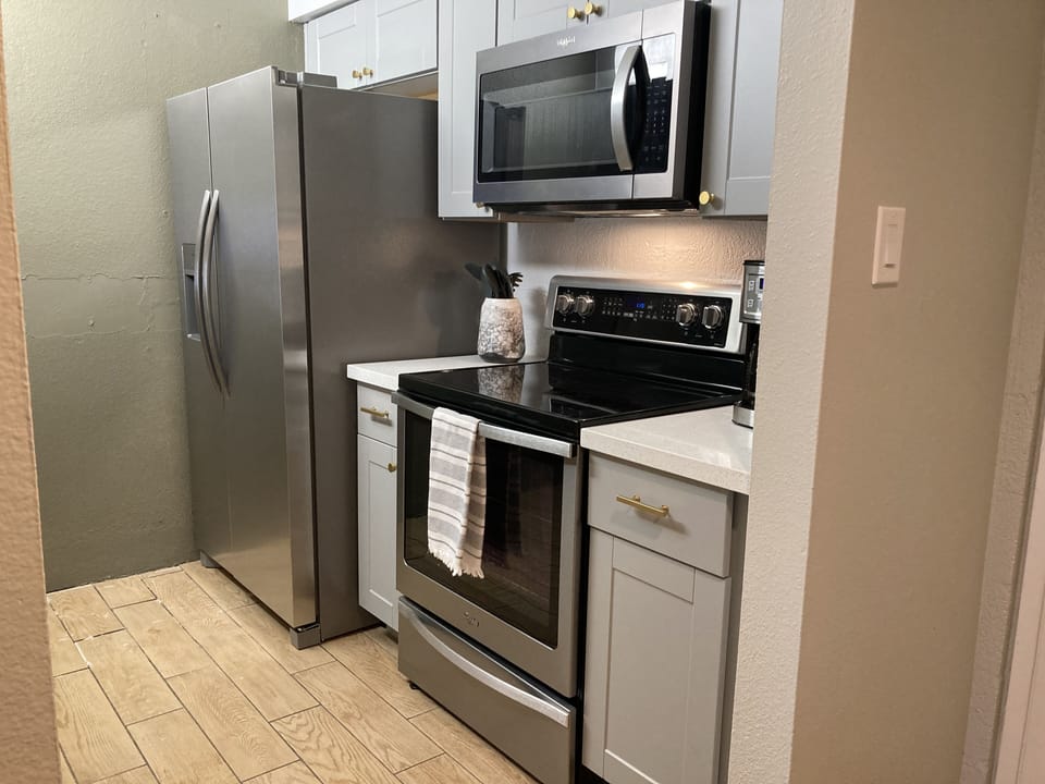 Newly renovated kitchen with brand new cabinets and granite countertops