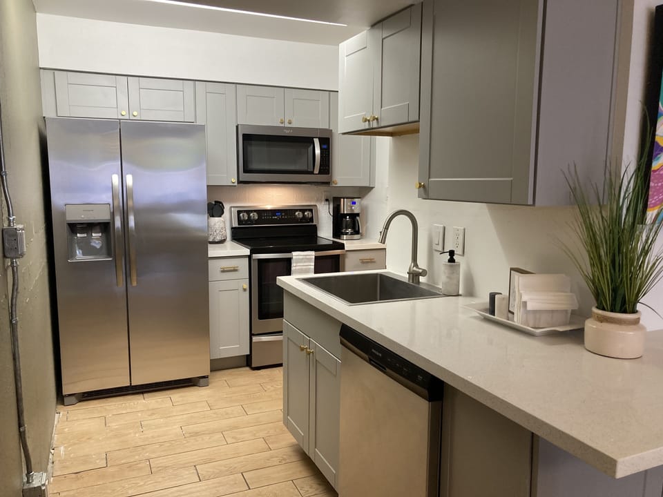 Newly renovated kitchen with brand new cabinets and granite countertops