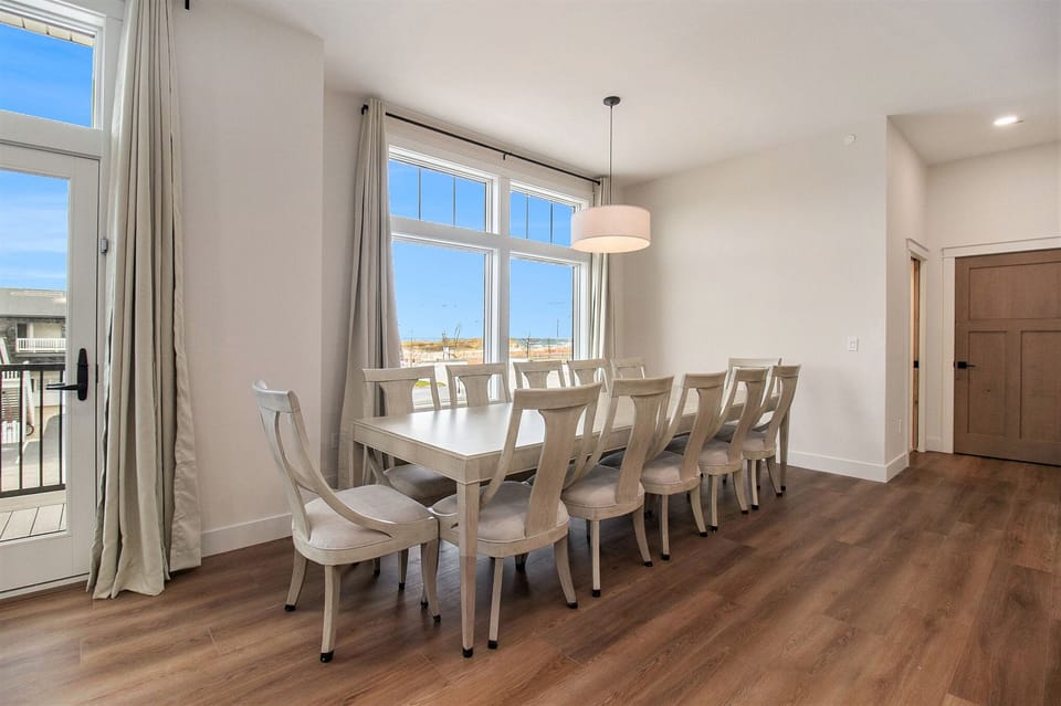 2nd floor dining room table and 12 chairs.