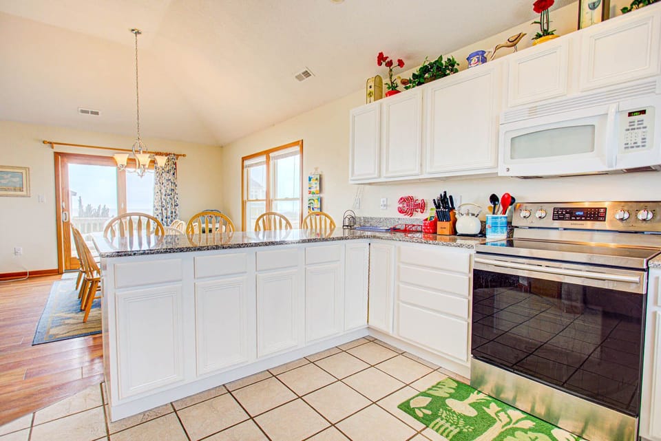 . A large Kitchen with modern appliances, two dishwashers, and plenty of prep space will make it easy for you to cook for the whole family.