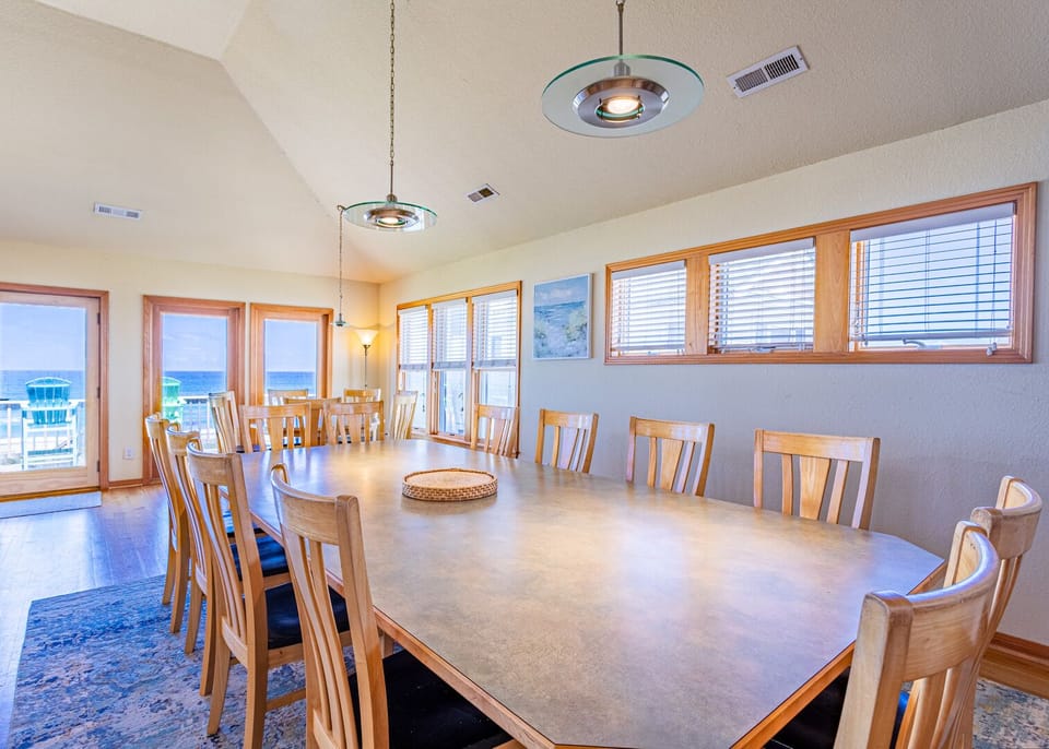 A large Dining Area has seating for 12 around the table with an additional breakfast table and more seating at the kitchen bar if needed.