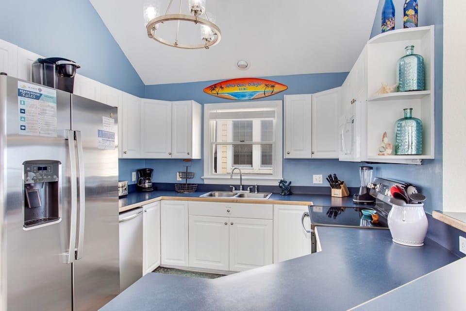 Whip up something delicious in the Modern Kitchen with stainless steel appliances.