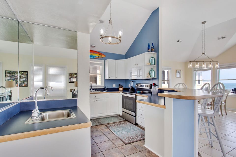 Whip up something delicious in the Modern Kitchen with stainless steel appliances.