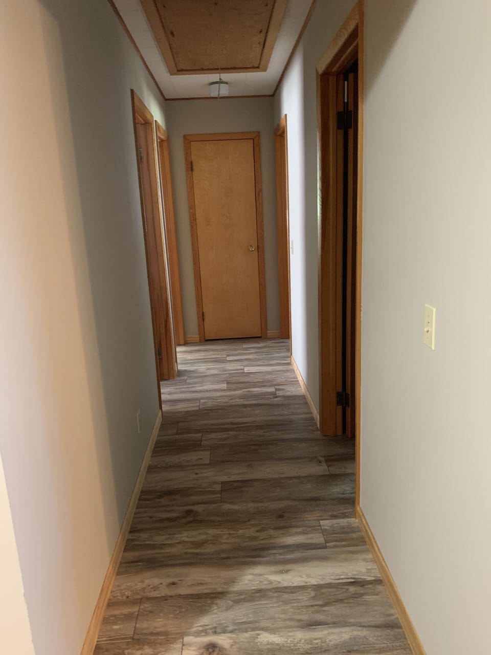 Hallway to 3 bedrooms and middle bathroom 