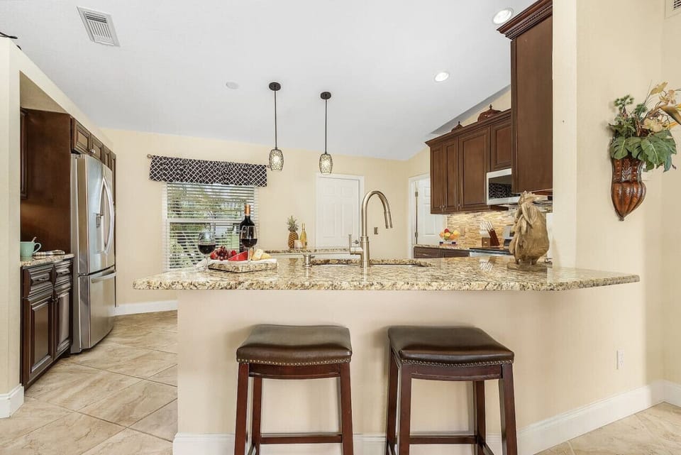 Pull up a barstool and chat with the chef - granite counter tops for a clean cool feel