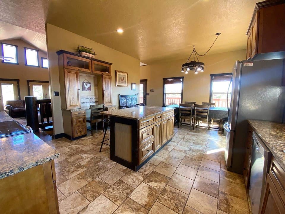 The kitchen and dining areas are just steps away from the living room.