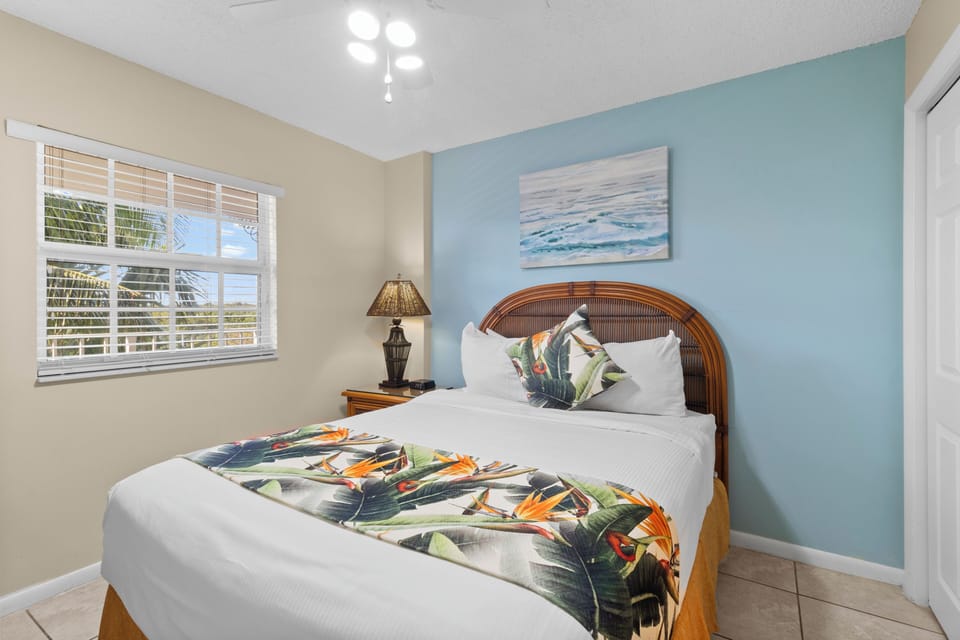 Unwind in a serene bedroom with crisp linens and coastal calm.