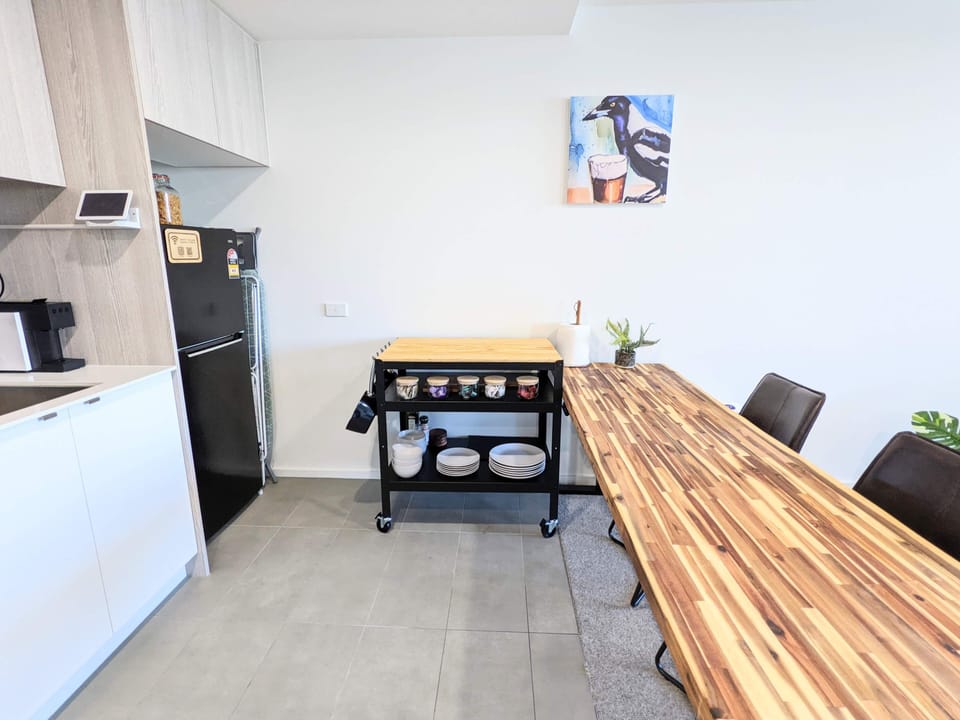 Kitchen area with height adjustable dining bench