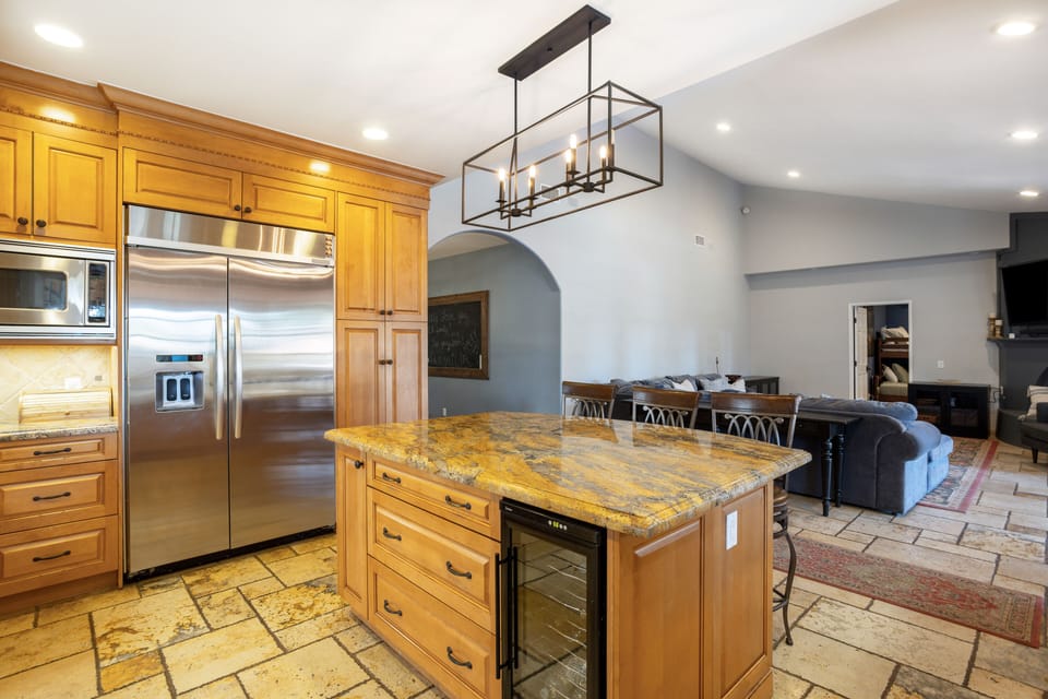 Beautiful and functional kitchen with everything you could need and more! Large island, wine fridge, dishwasher, stove, and so much more!