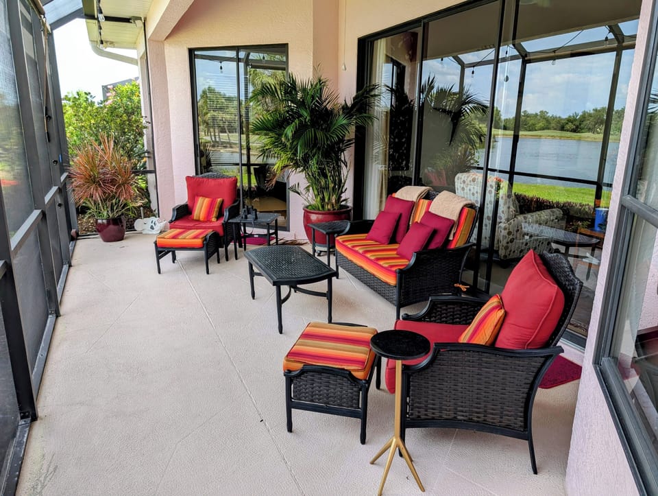 View of main lanai.  Great outdoor space with large mature container plantings.