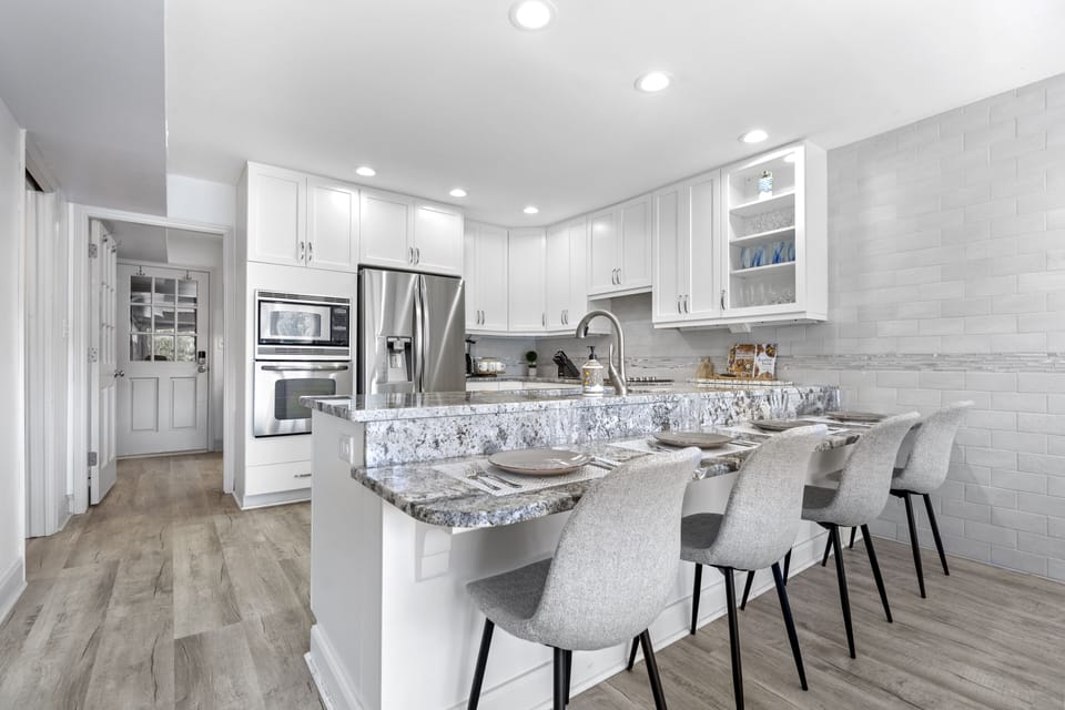Large kitchen for cooking meals and 4 counter seats in addition to dining table.