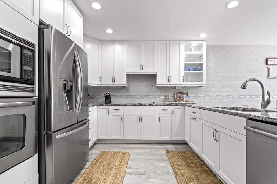 Fully stocked kitchen with pots, pans, dishes, and everything you may need