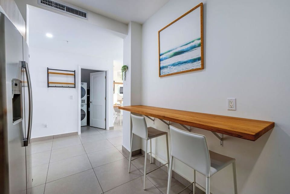 A bright, modern bathroom with a spacious walk-in shower, sleek vanity, and thoughtful touches like quality amenities awaits your morning refresh.