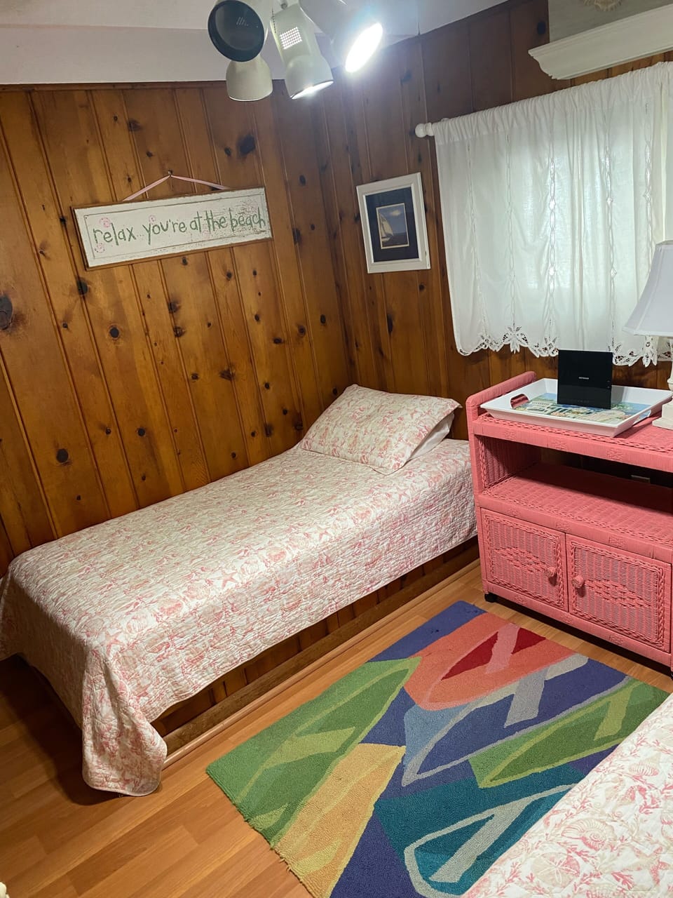 Cheery beach themed back bedroom