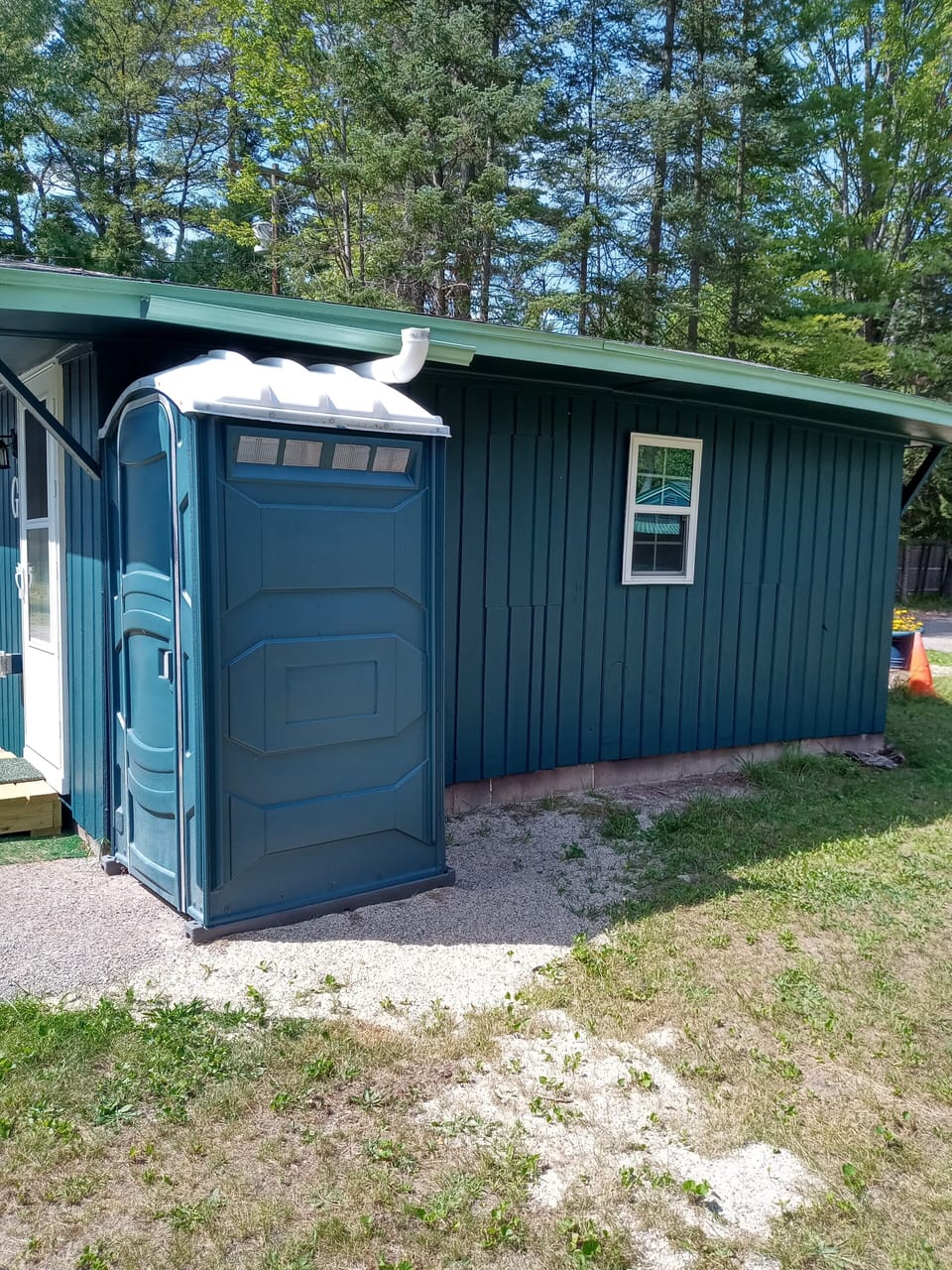 Back of cabin #G.  Showing porta-john