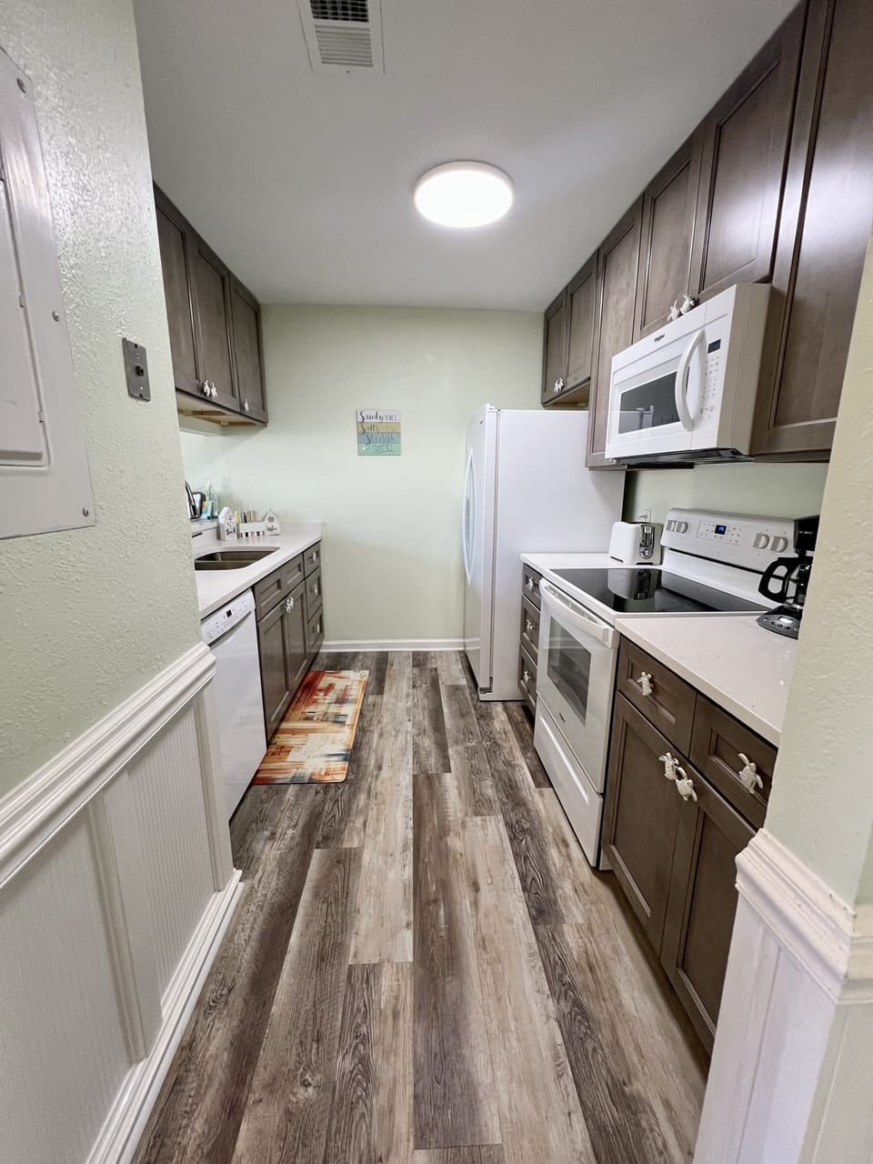 The kitchen offers new appliances for your use.