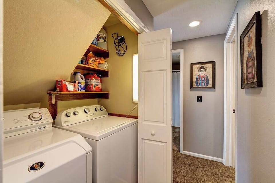 Laundry Room - Full-size washer and dryer with complimentary laundry supplies provided.