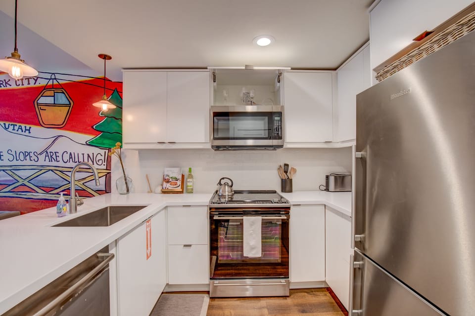 Kitchen with microwave, cooking range, oven, dish washer and refrigerator