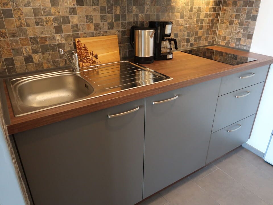 Cabinetry, Tap, Countertop, Kitchen Sink, Sink, Kitchen Appliance, Kitchen, Plumbing Fixture, Kitchen Stove, Wood