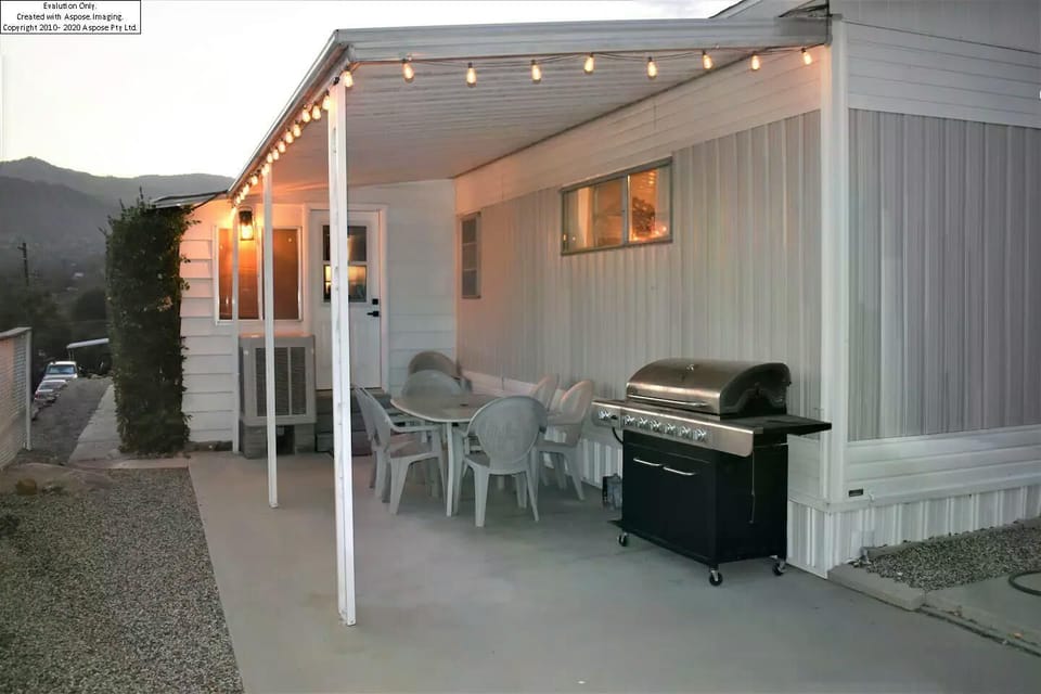 Patio with 6 seat dining table and BBQ