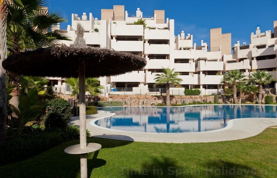 One of the swimming pools in this community surrounded by gardens