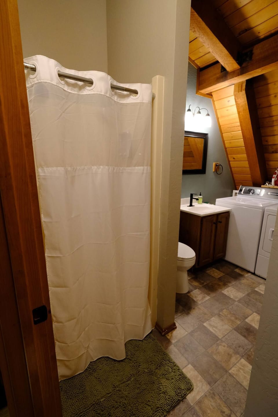 Bathroom with large shower stall.