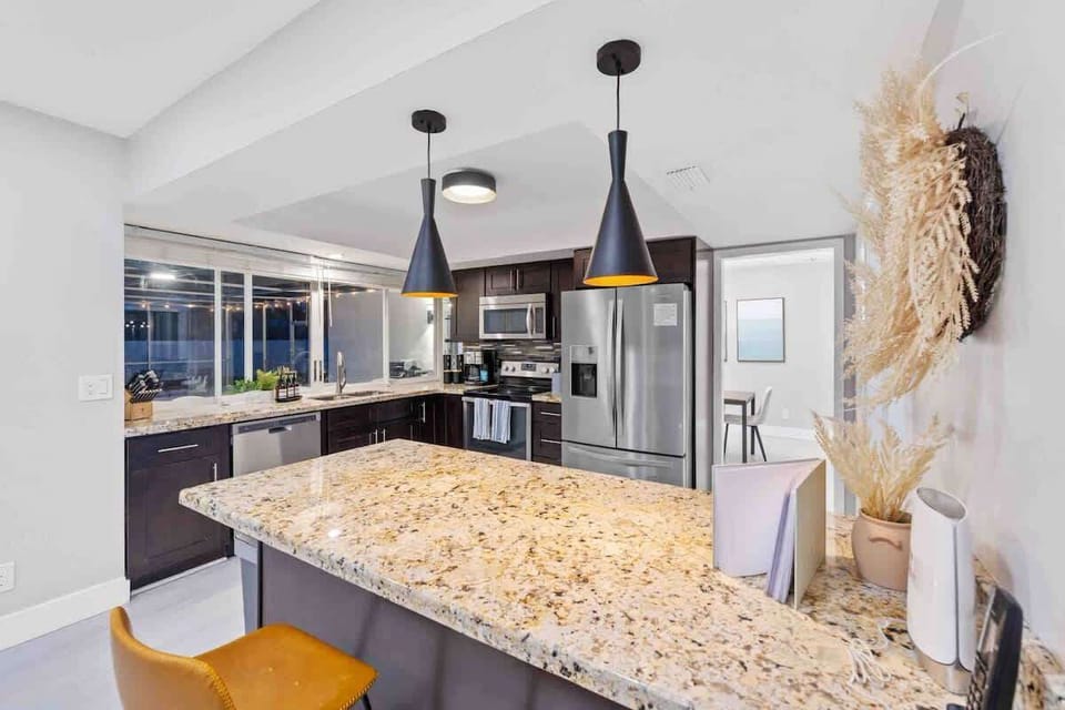 Bar counter with 2 stools.  Perfect for getting some quick work done and chat with the chef when they are cooking something delicious :). Please fill out our guestbook and tell us what you think of the SUN VILLA!