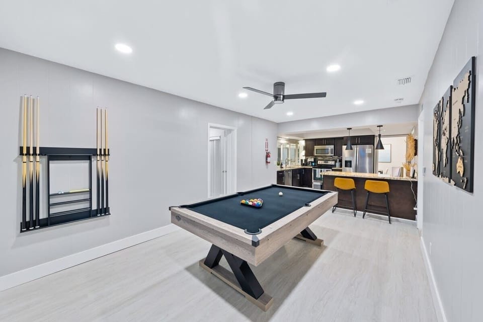Enjoy playing pool / billiards with family and friends - GAME ON!  Plus a 50-inch Roku smart TV and 2 bar stools