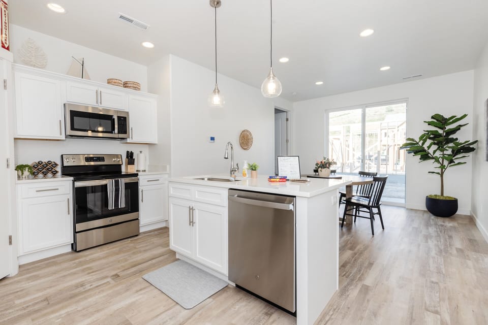 Main-level kitchen and dining room off back patio. Seats 9.