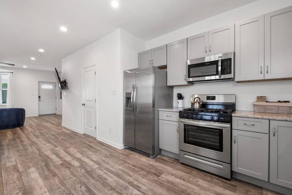 This stunning kitchen is perfect for entertaining guests or enjoying a quiet meal at home.