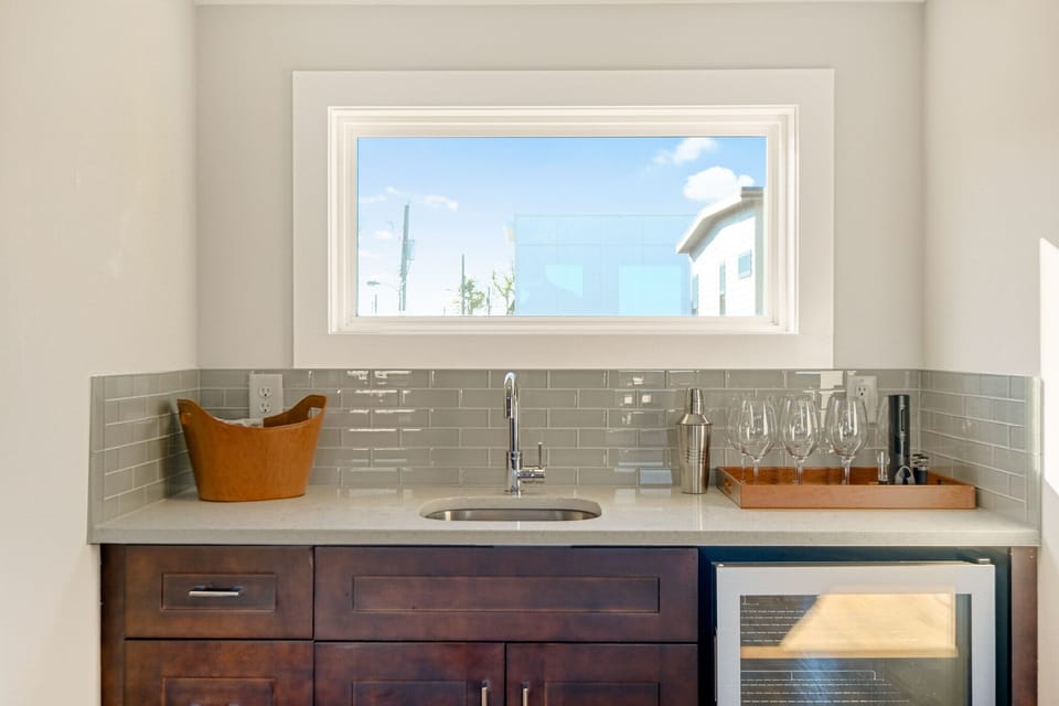 Wet Bar and Beverage Fridge in Arcade Room