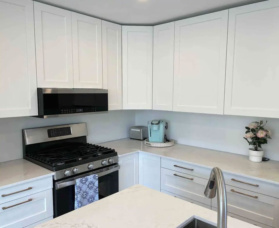 Kitchen, with quartz island.