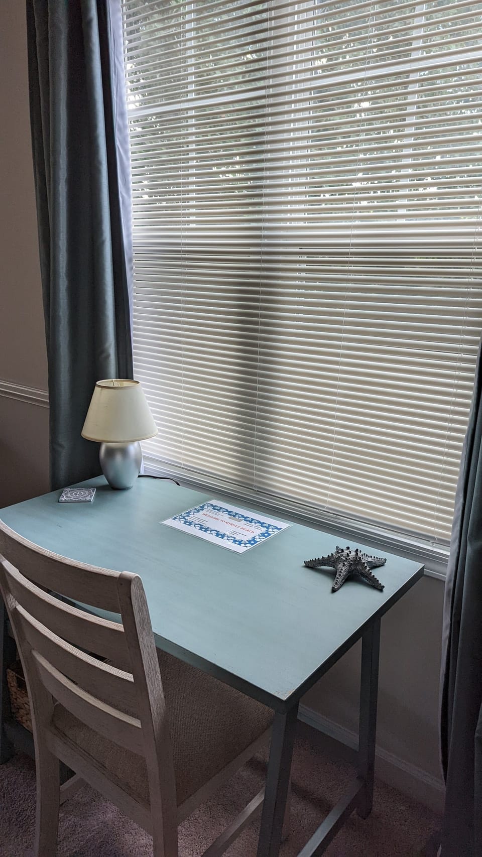 Desk and chair area is located in the living room.