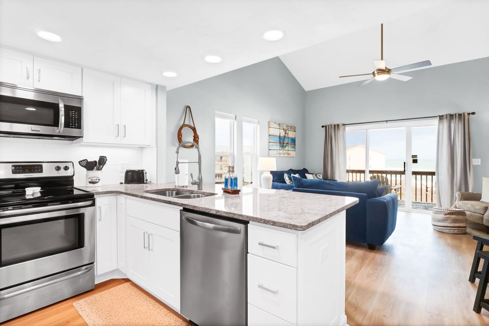 Open kitchen concept, dishwasher onsite, dish detergent and hand soap provided