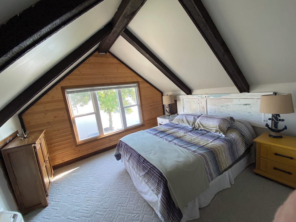Upstairs bedroom with lake view. 