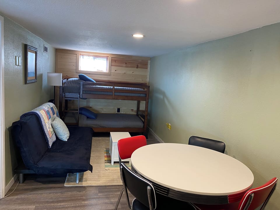 Downstairs open bedroom/game table