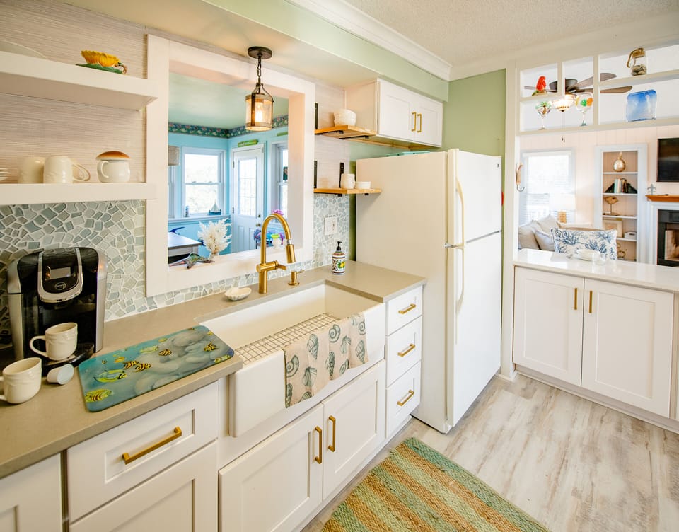 Kitchen opens to sunroom and living area 