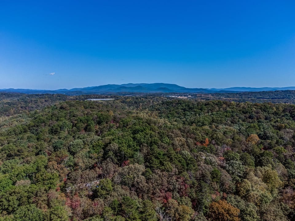View of cabin from above with the North Georgia Blue Ridge Mountains backdrop