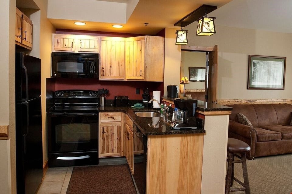 Cook delicious meals in the fully equipped kitchen with lovely wood cabinets