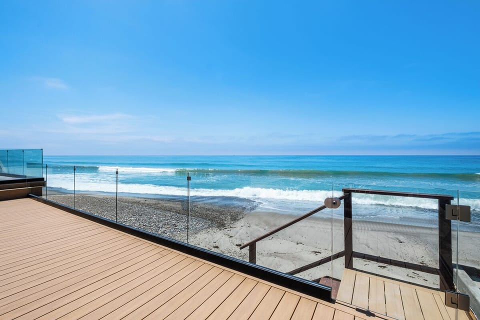 Beautiful glass wall and private steps down to your own beach!