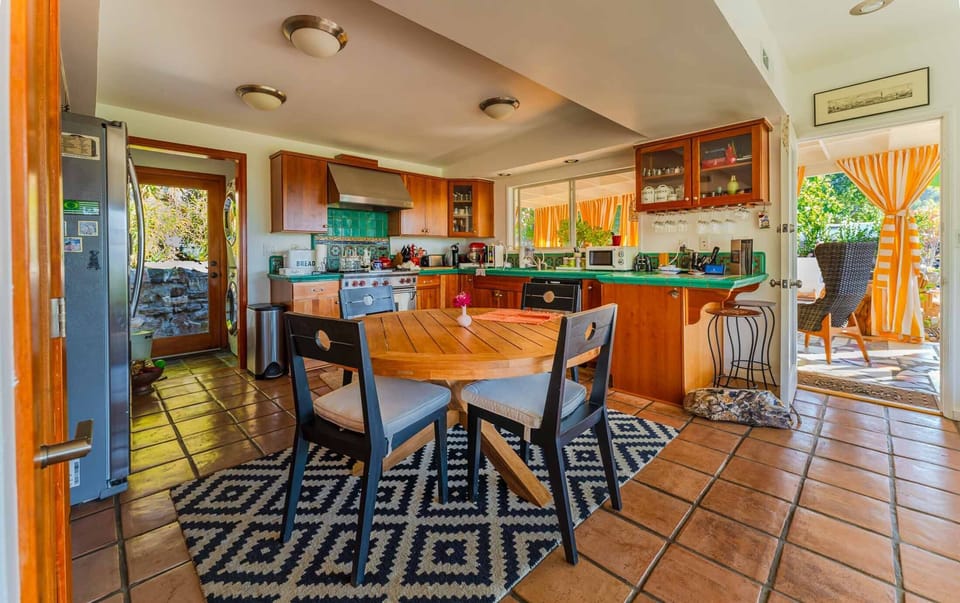 Dining Table, Malibu Tile Kitchen Counter, Surrounded With Solid Cherry Cabinets