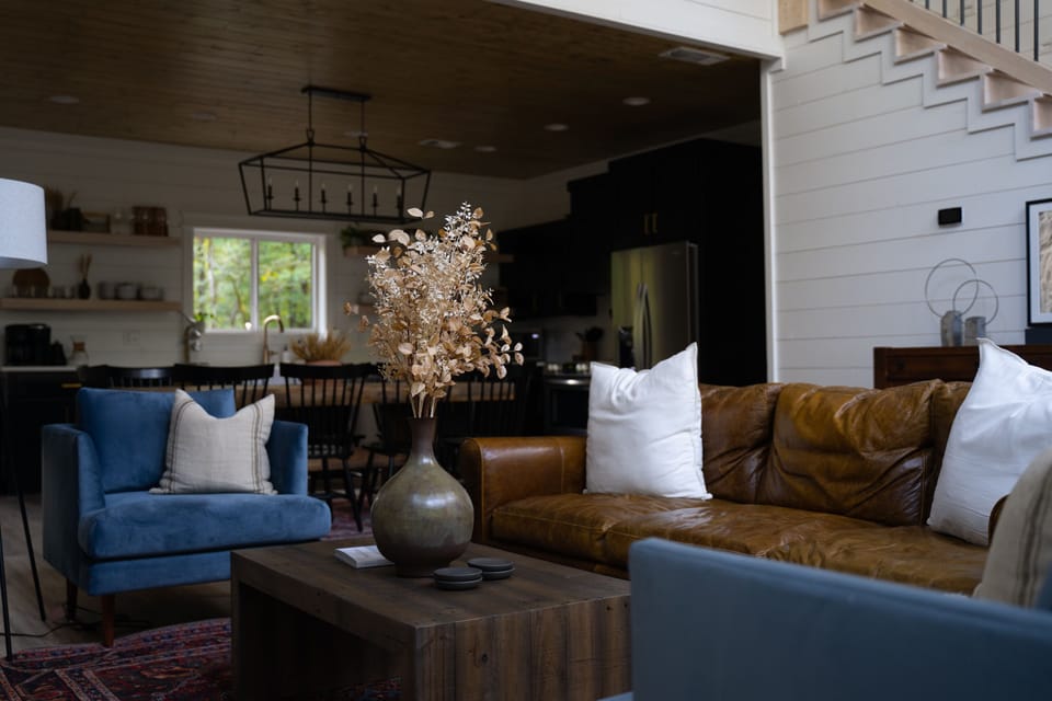 Enjoy the comfortable seating around the fire in the gorgeously designed living area