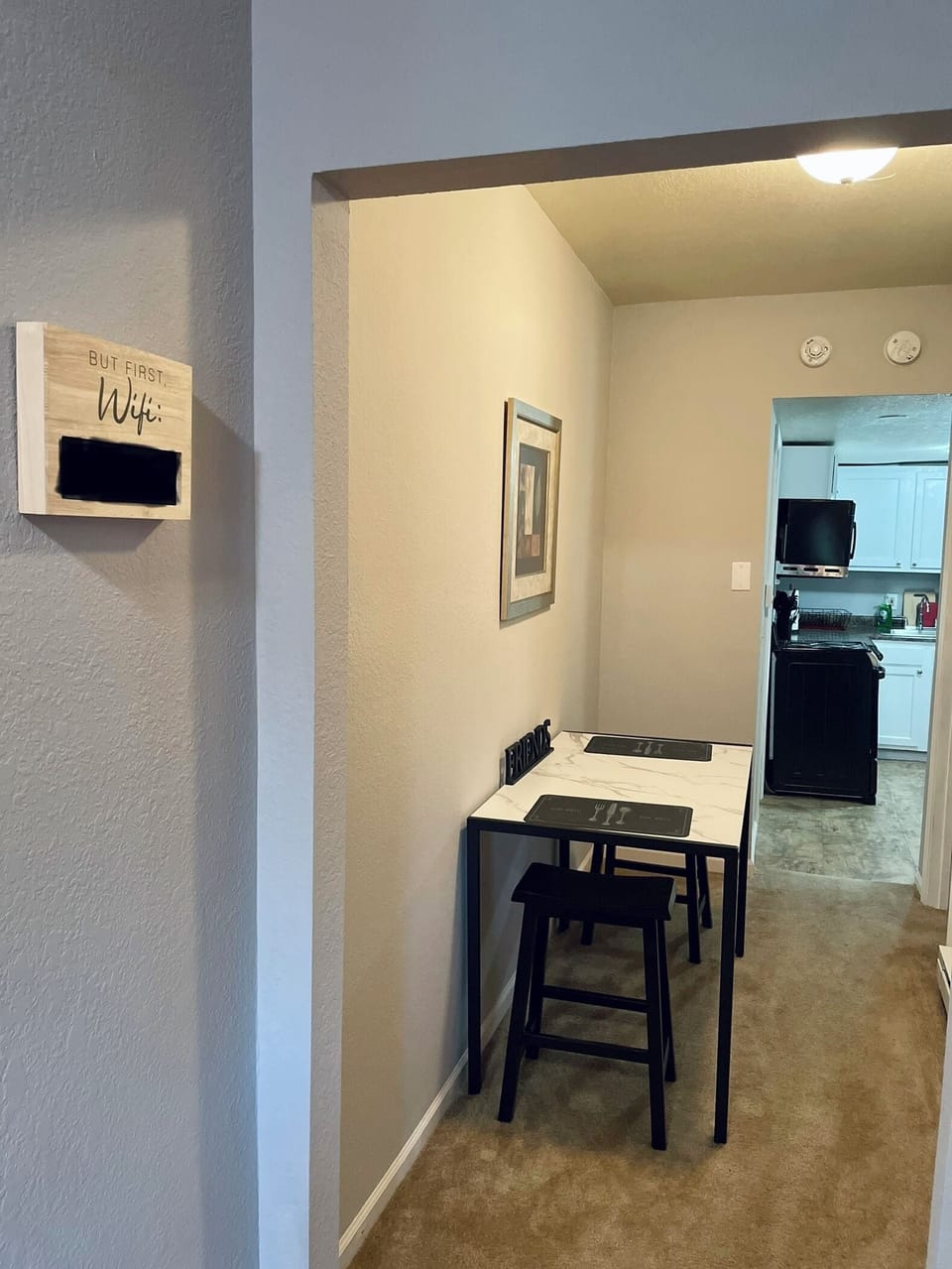 Entry way of dining area/walk way to kitchen, bathroom, and bedroom.
