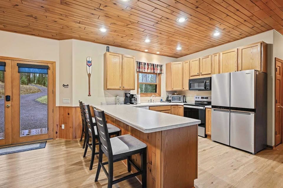 Spacious kitchen with stove, fridge, dishwasher, microwave, and all the cooking essentials such as pots, pans, and utensils.  (Due to health dept guidelines we are not allowed to leave and food/seasonings for guests use)