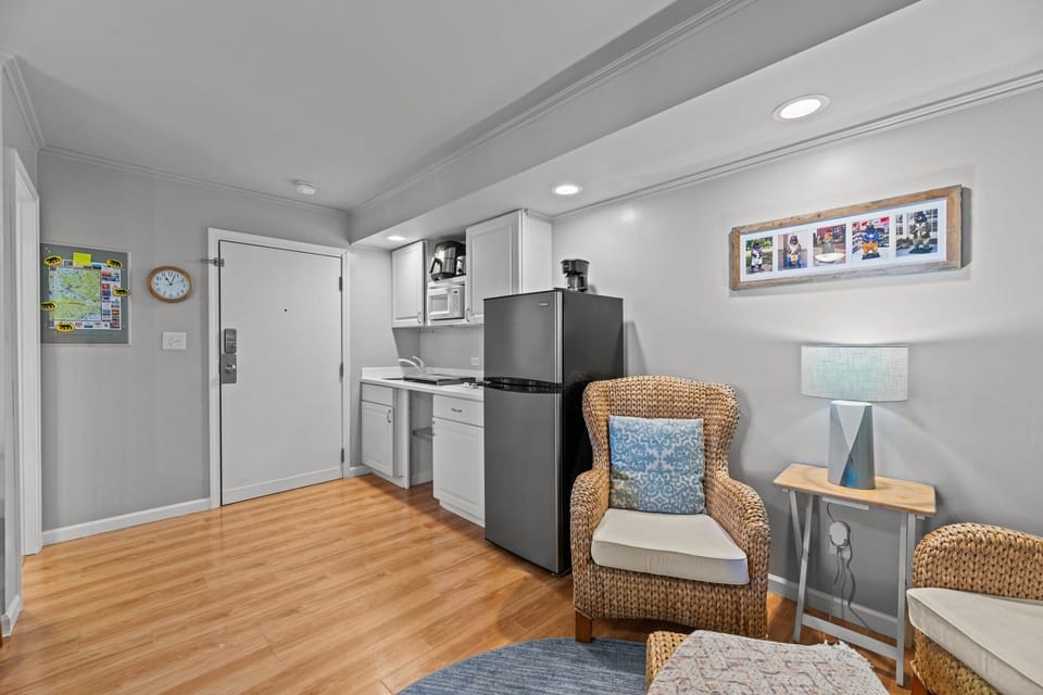 Convenient kitchenette right by the cozy seating area! 