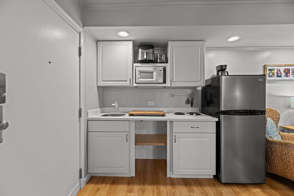 Efficient kitchenette with a cooktop for easy meals!