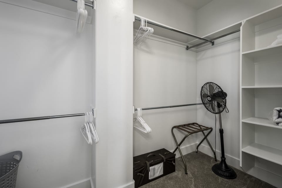 Large Master closet with pack 'n play.