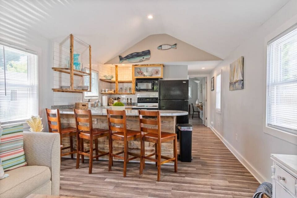 Sun-filled kitchen, equipped for cooking and entertainment.